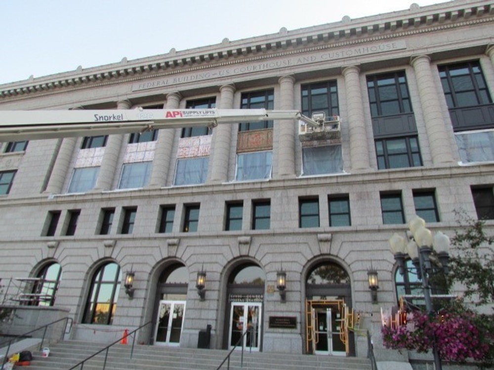 Exterior of the Duluth Federal Courthouse with a lift positioned near upper windows
